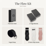 The Flow Kit in Gray / Black: gray yoga mat with black underside, 2 yoga blocks, yoga strap and 3 pairs of grip socks